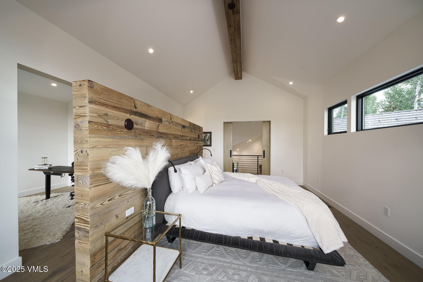 880 Forest Trail Edwards, CO 81632 - Photo 70 of 119 a bedroom with a bed and a chandelier