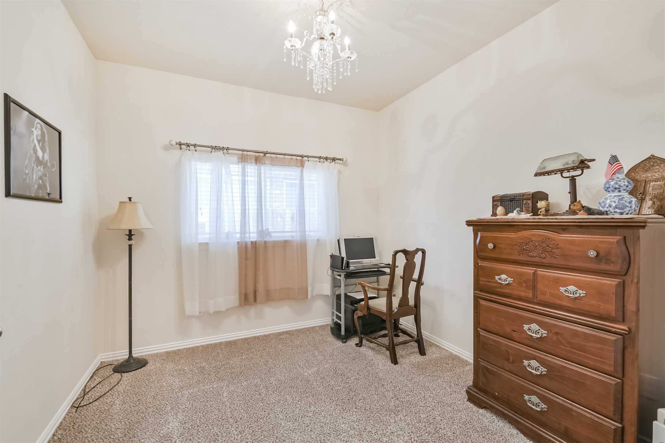 7527 Windsor Valley Lane Houston, TX 77049 - Photo 29 of 35 a view of a workspace with furniture and a window