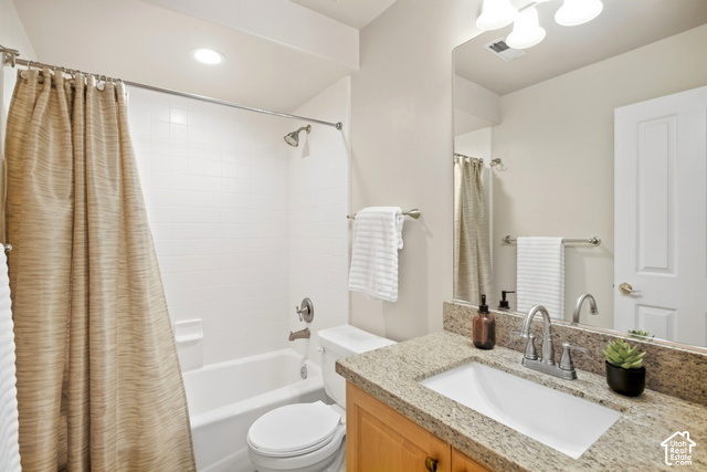 7396 Brook Hollow Loop Road Park City, UT 84098 - Photo 29 of 60 White subway tile shower surround with a built-in tub, a vanity with a light-colored stone countertop, a rectangular undermount sink, and a large wall-mounted mirror