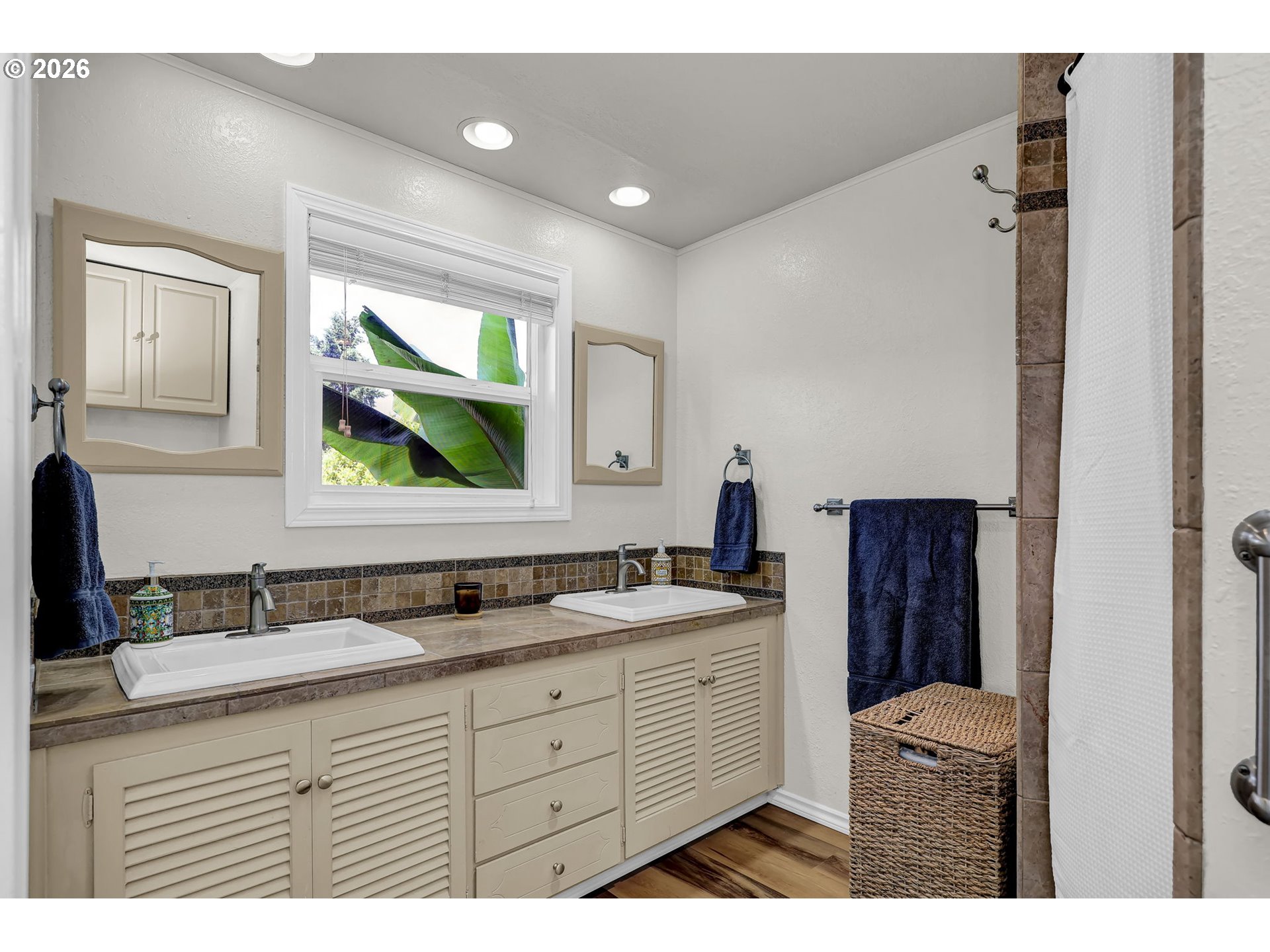 90440 Goodman Road Junction City, OR 97448 - Photo 15 of 48 a bathroom with a double vanity sink and mirror