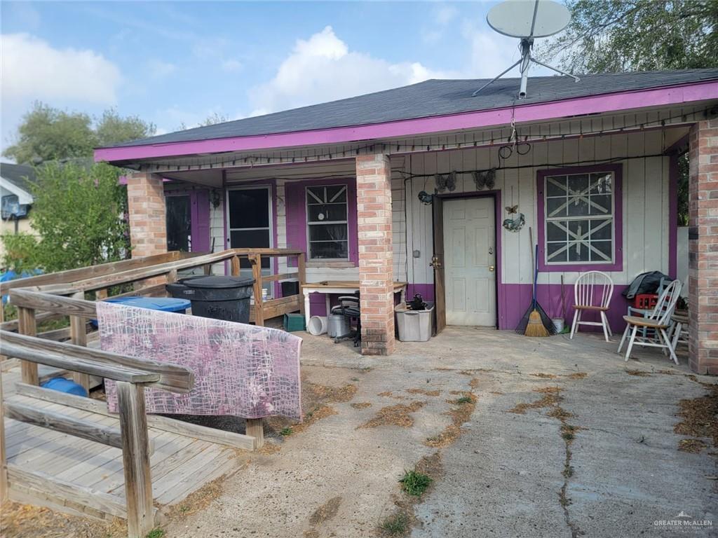 a view of a chairs and table in the patio