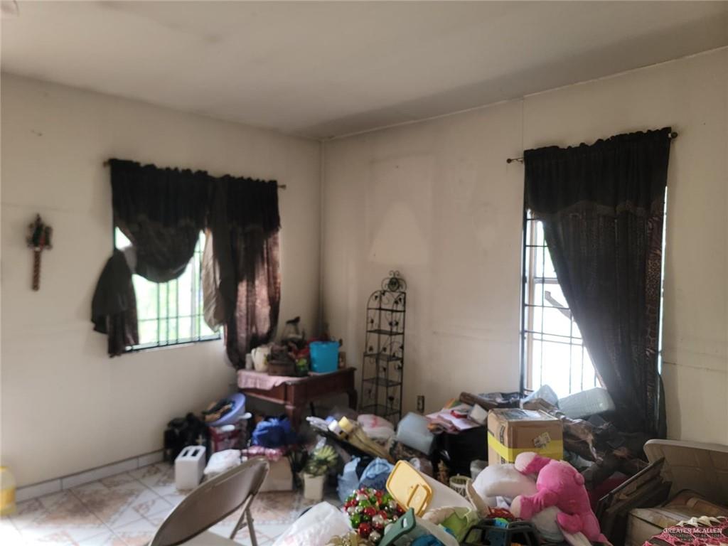 2132 Azteca Avenue McAllen, TX 78503 - Photo 11 of 17 a room with furniture and window