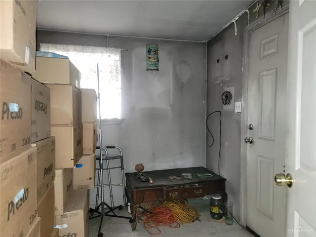 a room that has a bed and a desk in it