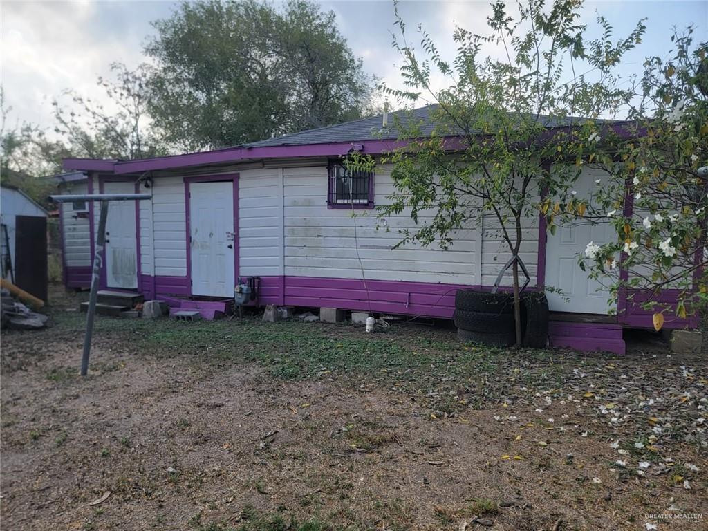 2132 Azteca Avenue McAllen, TX 78503 - Photo 3 of 17 a view of a backyard with a large tree