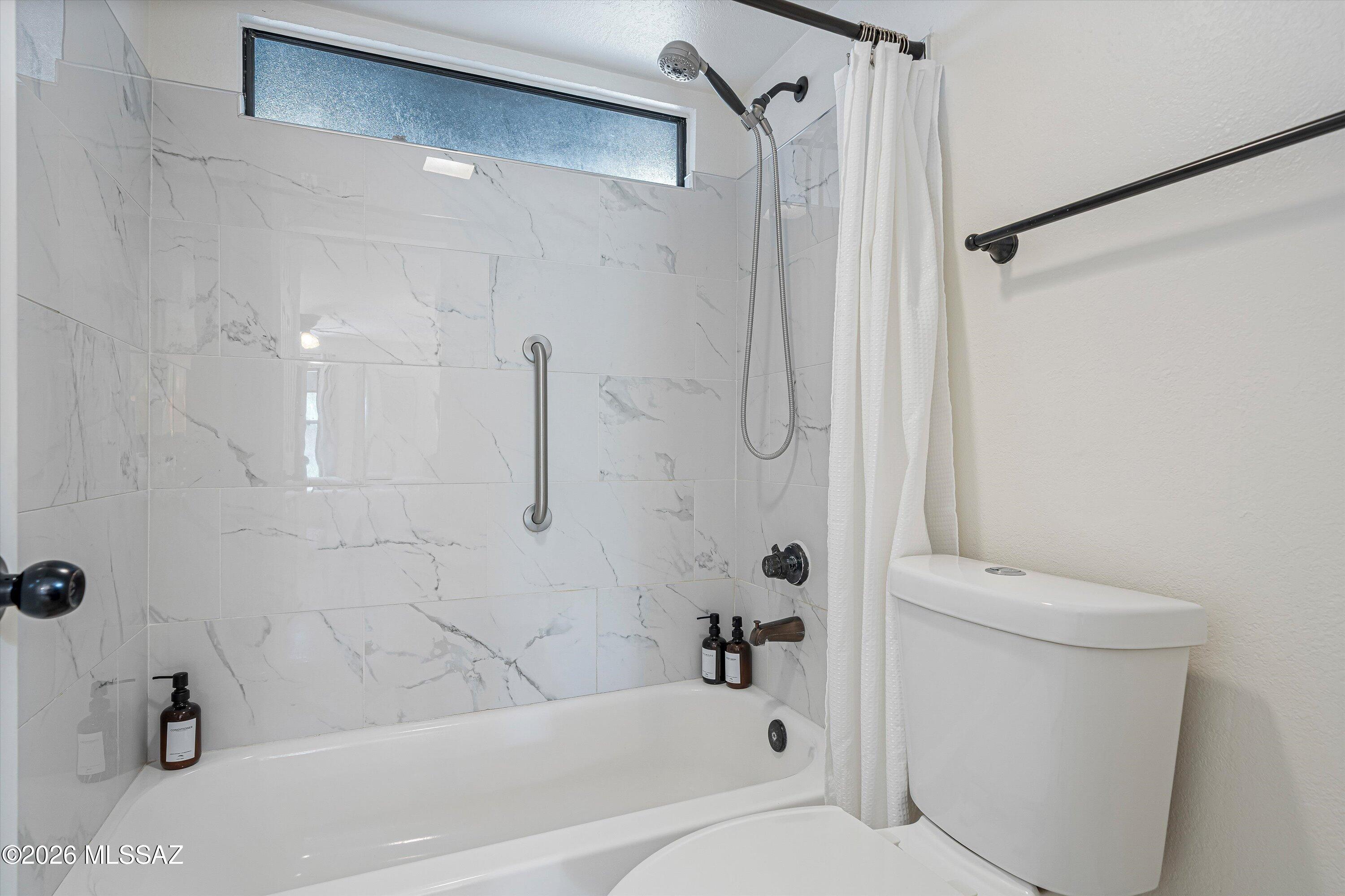 5800 North Kolb Road, Unit 5125 Tucson, AZ 85750 - Photo 16 of 34 a bathroom with a shower and a toilet