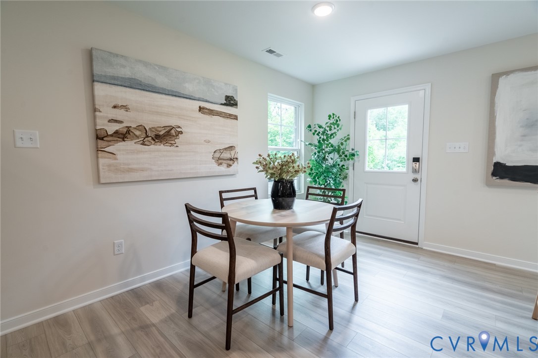 14655 Hancock Towns Drive, Unit Q3 Chesterfield, VA 23832 - Photo 11 of 19 a view of a dining room with furniture and wooden floor