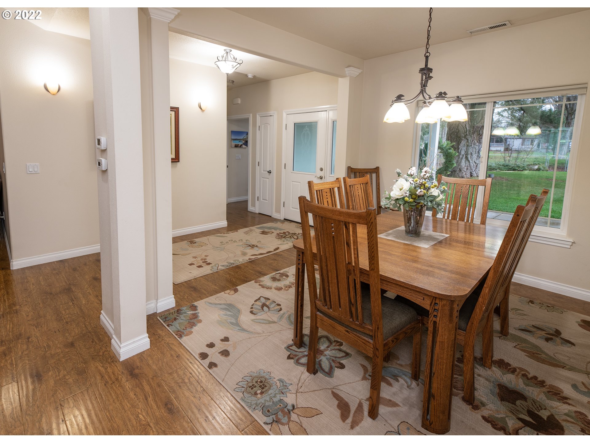 235 Boyer Road Grants Pass, OR 97526 - Photo 14 of 27 a view of a dining room with furniture window and wooden floor