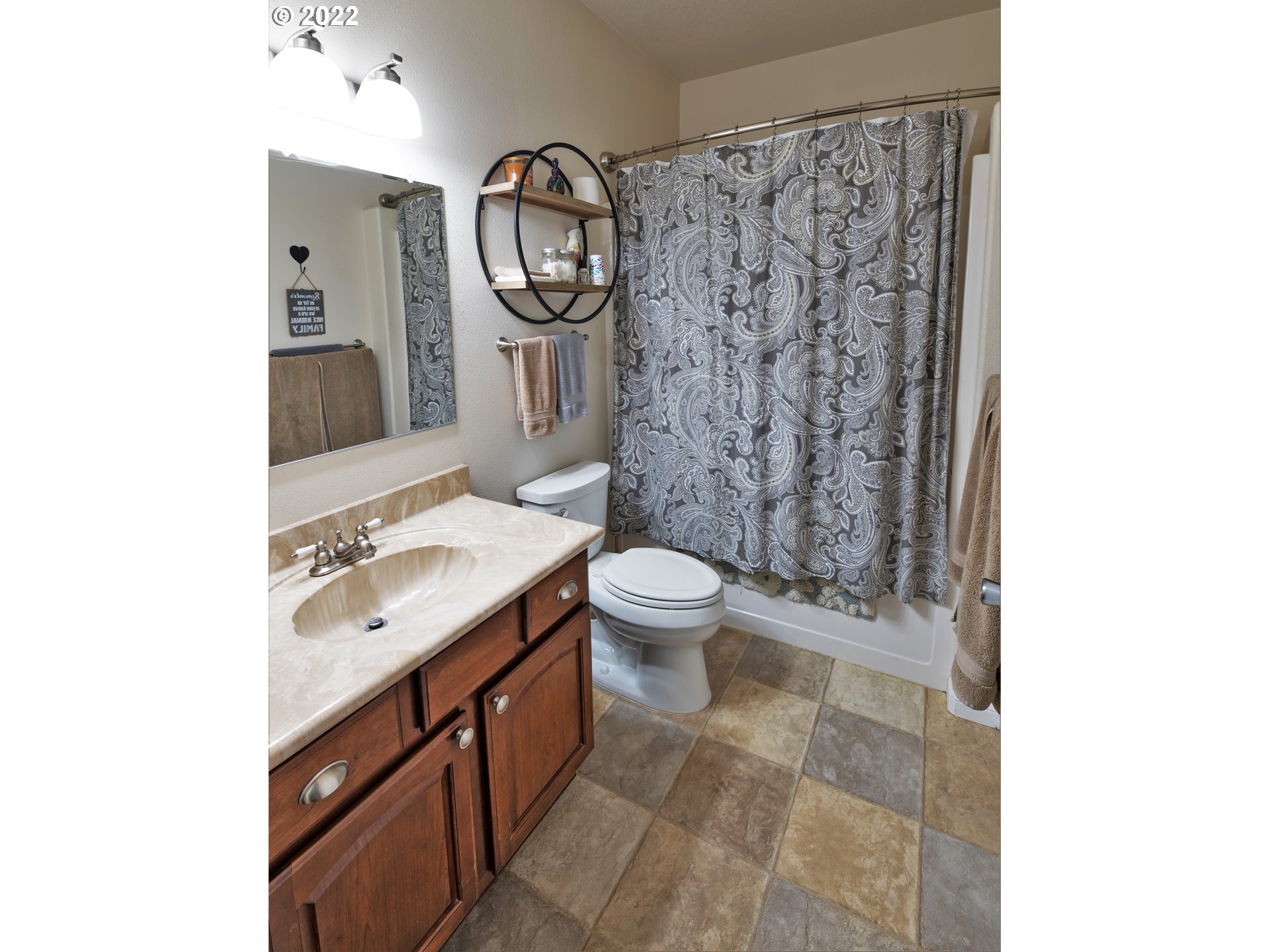 235 Boyer Road Grants Pass, OR 97526 - Photo 16 of 27 a spacious bathroom with a toilet sink and mirror