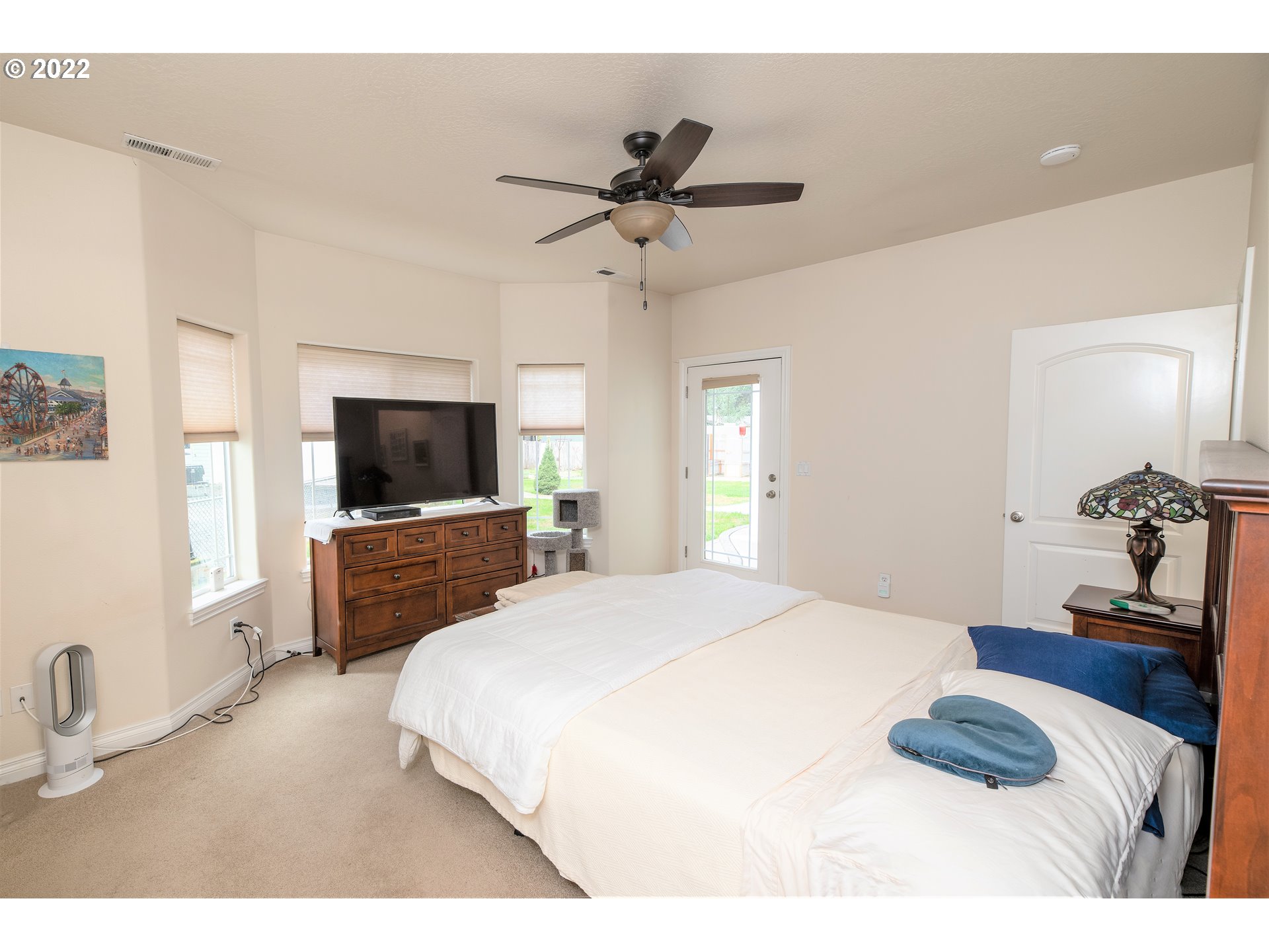 235 Boyer Road Grants Pass, OR 97526 - Photo 18 of 27 a bedroom with a bed and a flat screen tv