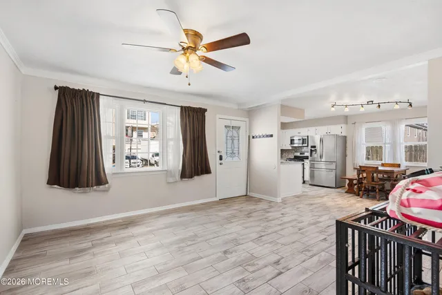 a kitchen with refrigerator cabinets dining table and chairs