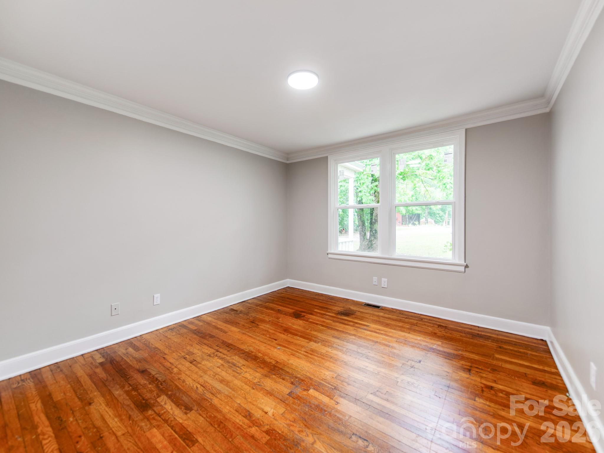 4699 Cherrystone Road Lancaster, SC 29720 - Photo 21 of 28 wooden floor in an empty room with a window