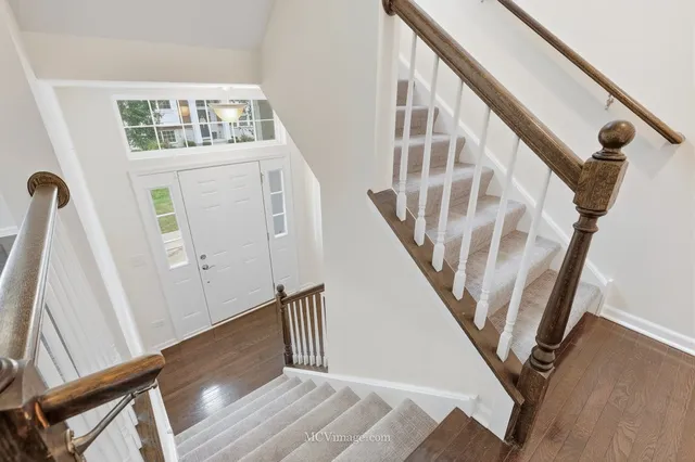 a view of an entryway with wooden floor