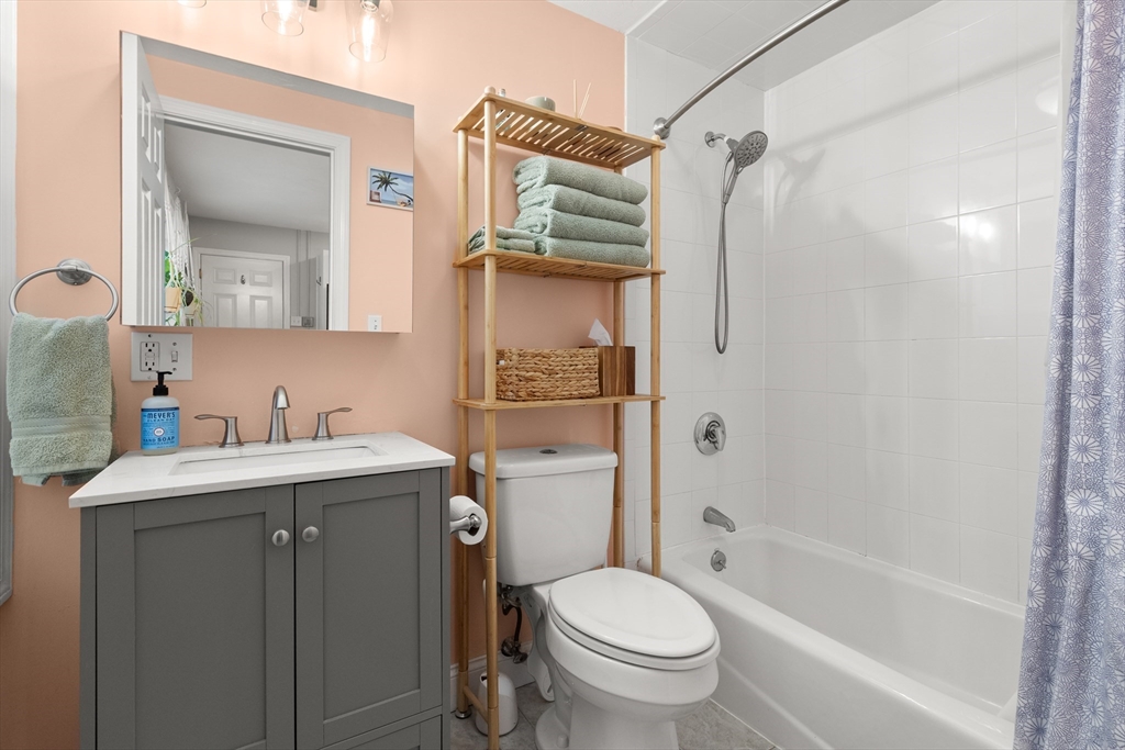 39 1/2 Harbor Street, Unit 1 Salem, MA 01970 - Photo 17 of 26 a bathroom with a granite countertop sink toilet and shower