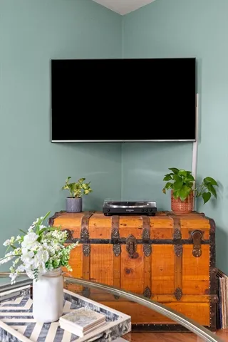 a table with potted plant and a lamp on it