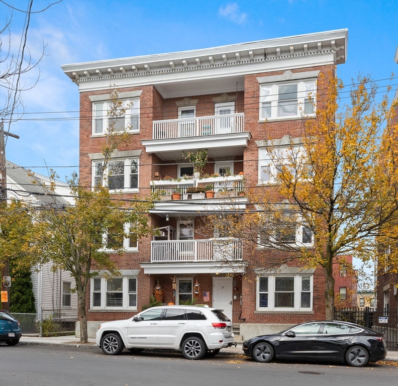 39 1/2 Harbor Street, Unit 1 Salem, MA 01970 - Photo 23 of 26 a car parked in front of a building