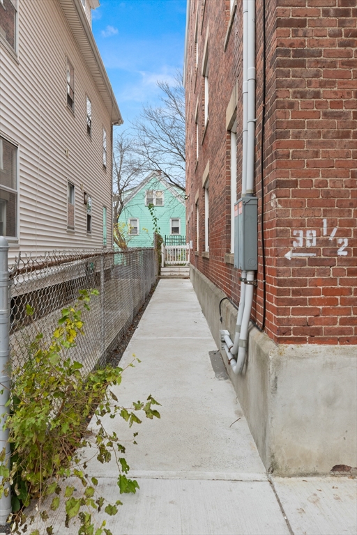 39 1/2 Harbor Street, Unit 1 Salem, MA 01970 - Photo 24 of 26 a view of a backyard with large trees