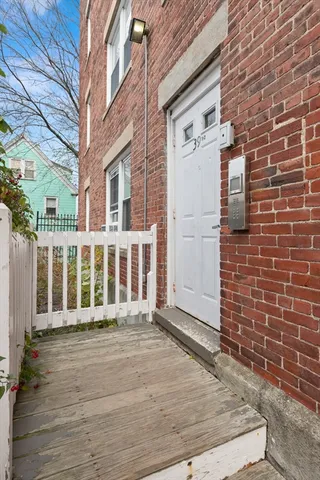 a view of a brick buildings with many windows