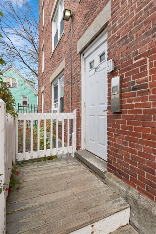 39 1/2 Harbor Street, Unit 1 Salem, MA 01970 - Photo 25 of 26 a view of a brick buildings with many windows