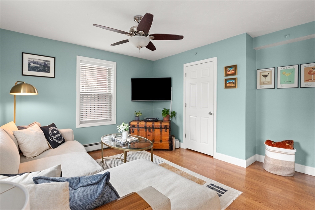39 1/2 Harbor Street, Unit 1 Salem, MA 01970 - Photo 4 of 26 a living room with furniture and a flat screen tv