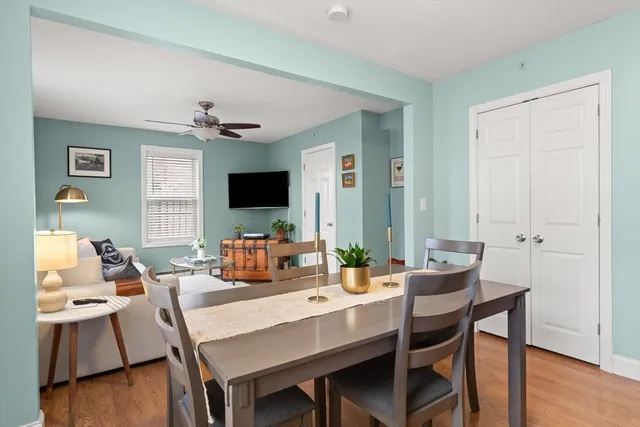 a view of a dining room with furniture window and wooden floor