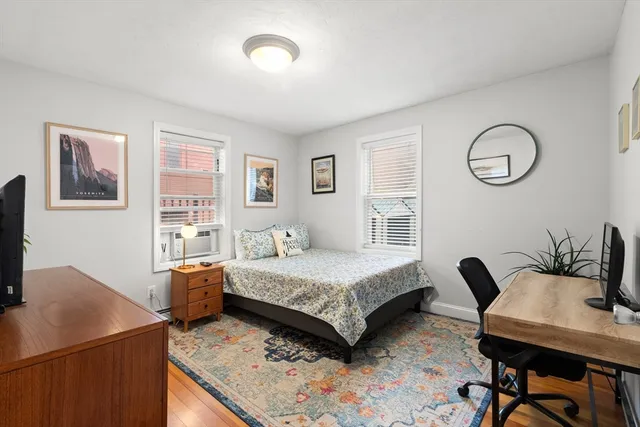 a bedroom with a bed and a table in it