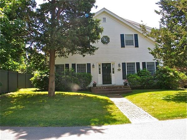 101 Peases Point Way Edgartown, MA 02539 - Photo 1 of 15 a front view of a house with a yard