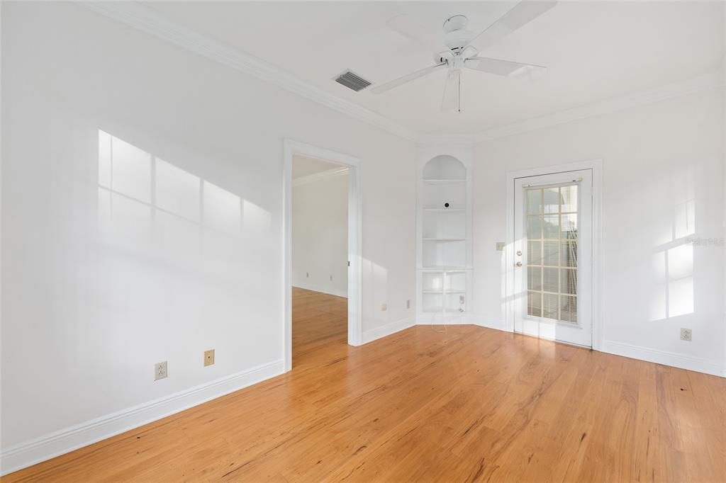 6581 South Magnolia Avenue Ocala, FL 34471 - Photo 15 of 59 a view of empty room with wooden floor and fan