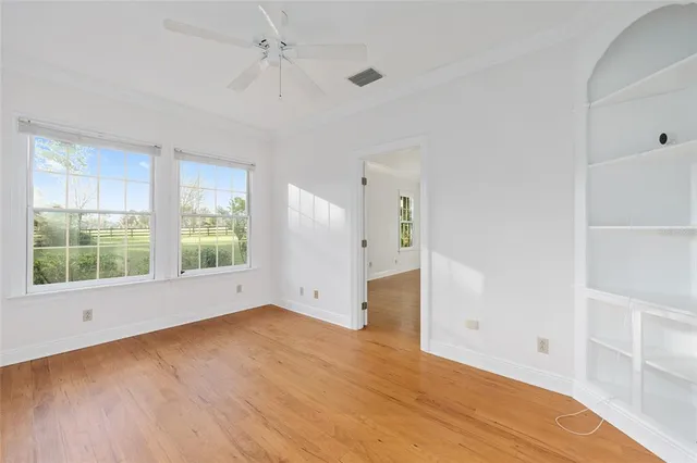 a view of a hallway with white walls