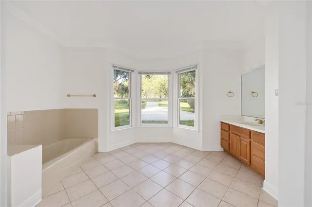 a white bath tub sitting next to a white toilet