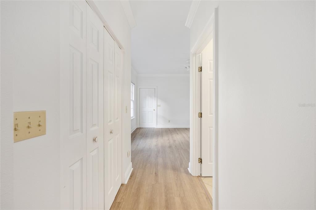 6581 South Magnolia Avenue Ocala, FL 34471 - Photo 24 of 59 a view of a hallway with wooden floor