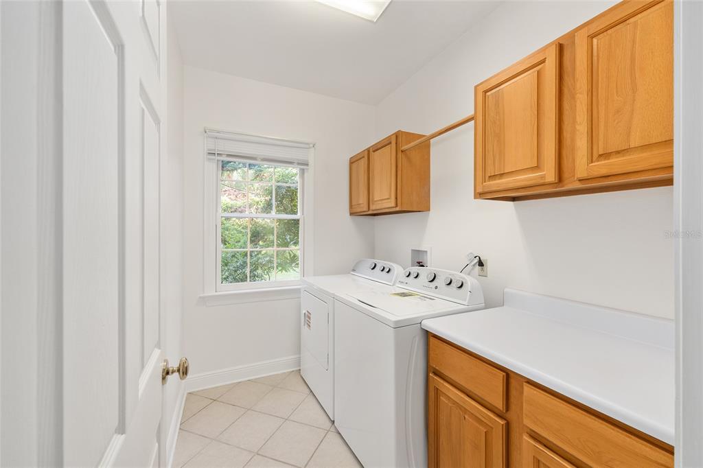 6581 South Magnolia Avenue Ocala, FL 34471 - Photo 25 of 59 a utility room with a sink dryer and washer