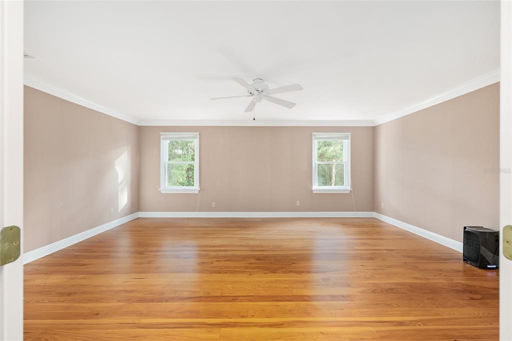 6581 South Magnolia Avenue Ocala, FL 34471 - Photo 30 of 59 a view of an empty room with a window and wooden floor