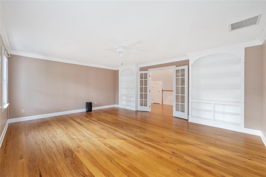 6581 South Magnolia Avenue Ocala, FL 34471 - Photo 31 of 59 a view of an empty room with wooden floor and a window