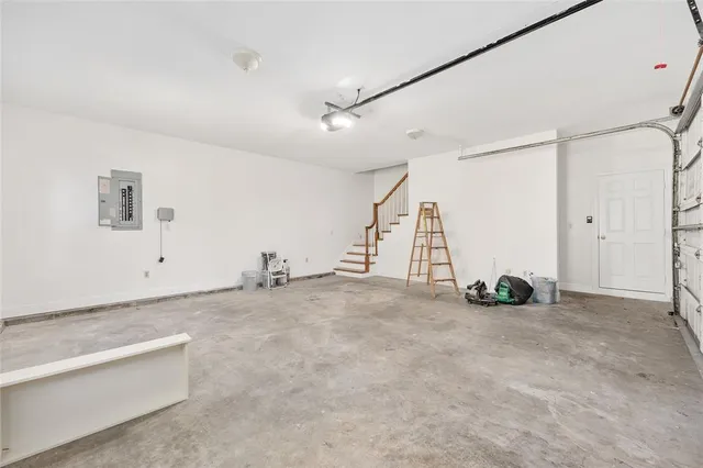an aerial view of a house with a yard and trees