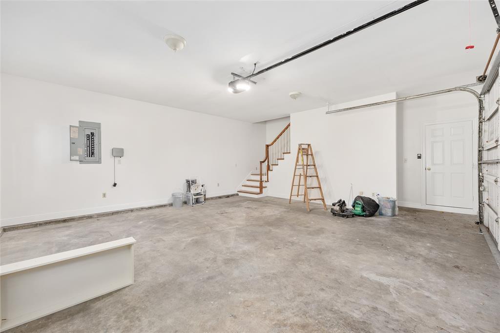 6581 South Magnolia Avenue Ocala, FL 34471 - Photo 47 of 59 a view of an empty room with entryway and stairs