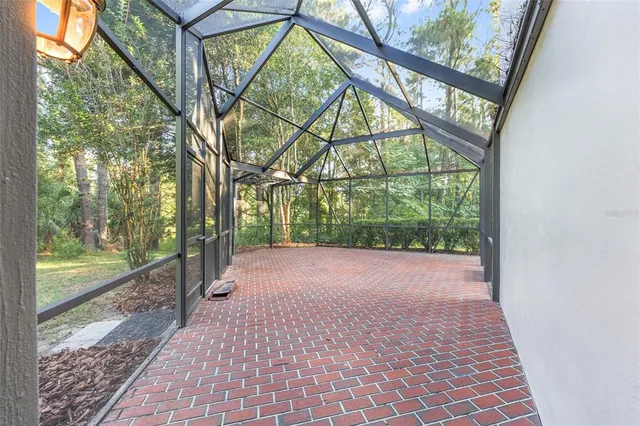 a view of a wooden house with a tree
