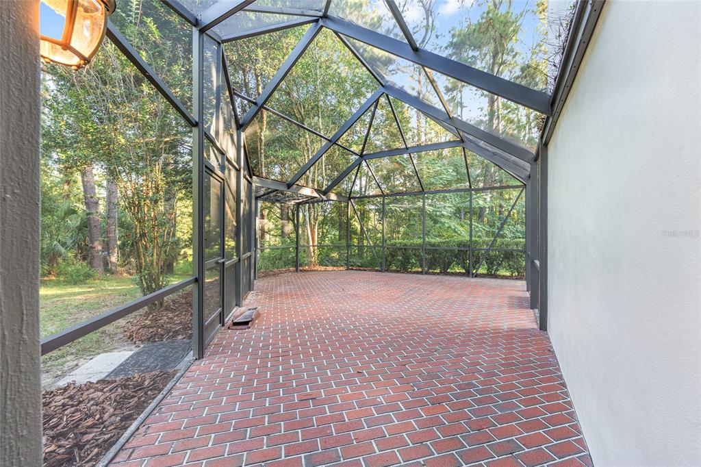 6581 South Magnolia Avenue Ocala, FL 34471 - Photo 48 of 59 a view of a porch with a trees in the background
