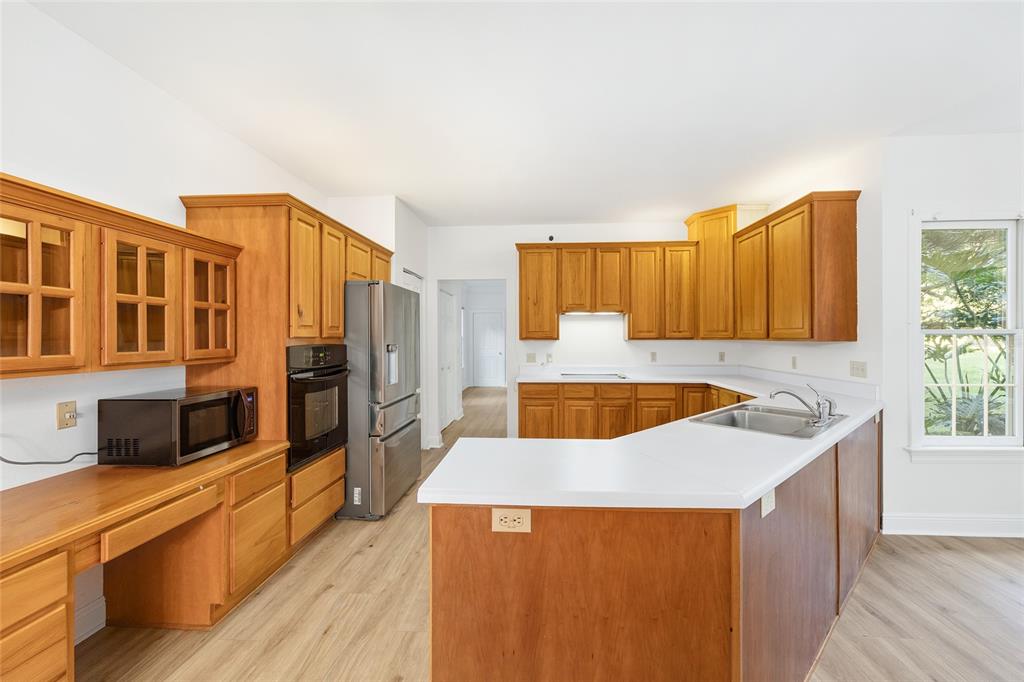 6581 South Magnolia Avenue Ocala, FL 34471 - Photo 7 of 59 a kitchen with stainless steel appliances granite countertop a stove a sink and a refrigerator