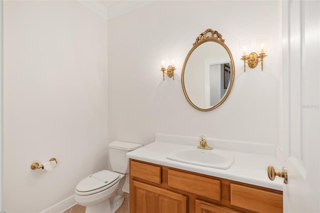 6581 South Magnolia Avenue Ocala, FL 34471 - Photo 10 of 59 a bathroom with a sink a toilet and a mirror