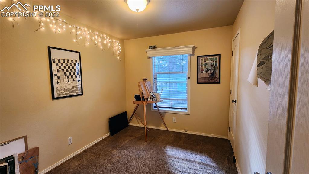 27650 Triple B Road Woodland Park, CO 80863 - Photo 11 of 18 a view of an entryway with wooden floor