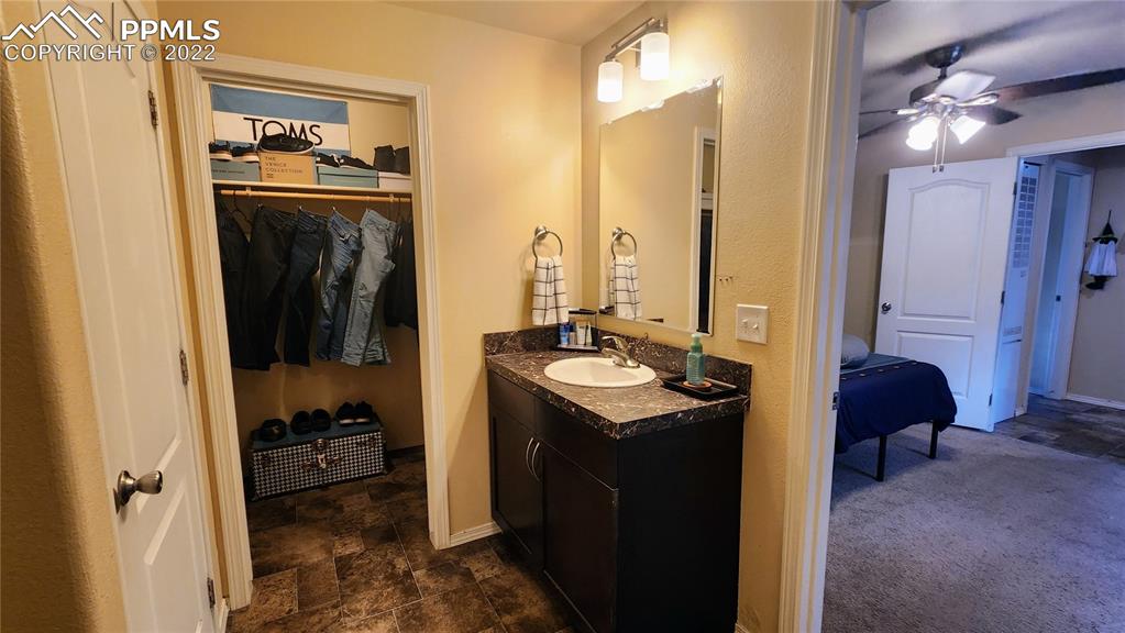 27650 Triple B Road Woodland Park, CO 80863 - Photo 9 of 18 a kitchen with a sink stove and refrigerator