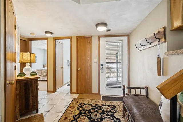a bathroom with a granite countertop sink a toilet and a mirror
