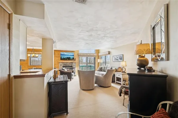 a large kitchen with a table and chairs