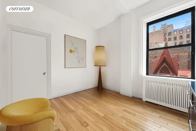 a view of a room with wooden floor and closet