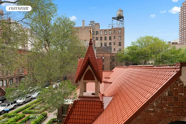 a white bath tub sitting next to a white toilet