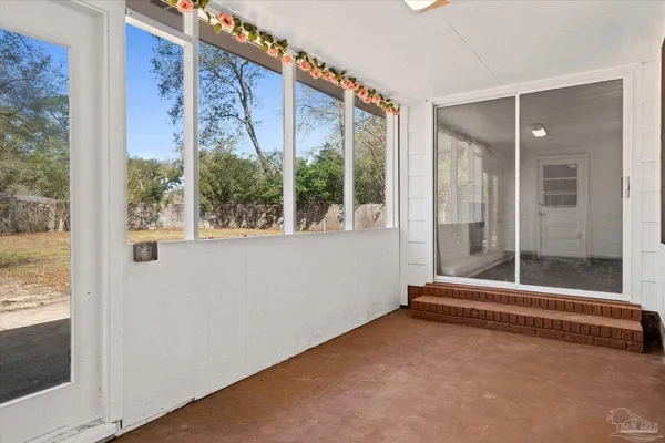 a view of an empty room and window