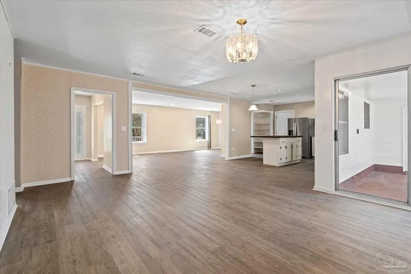 a view of a livingroom with wooden floor