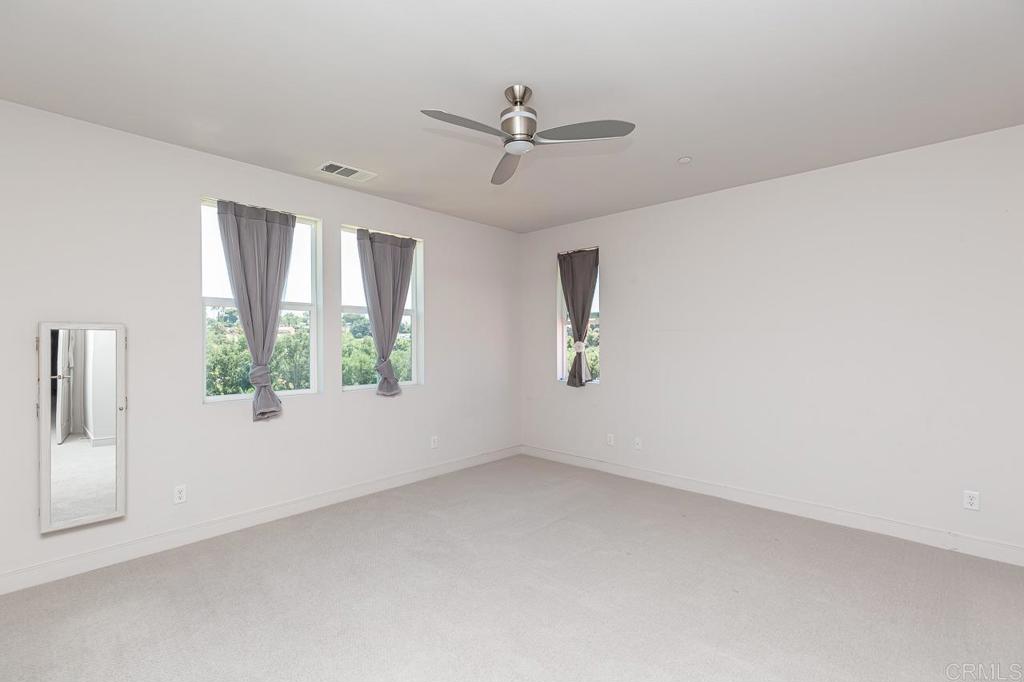 1281 Palomar Circle Escondido, CA 92027 - Photo 16 of 31 an empty room with windows and closet
