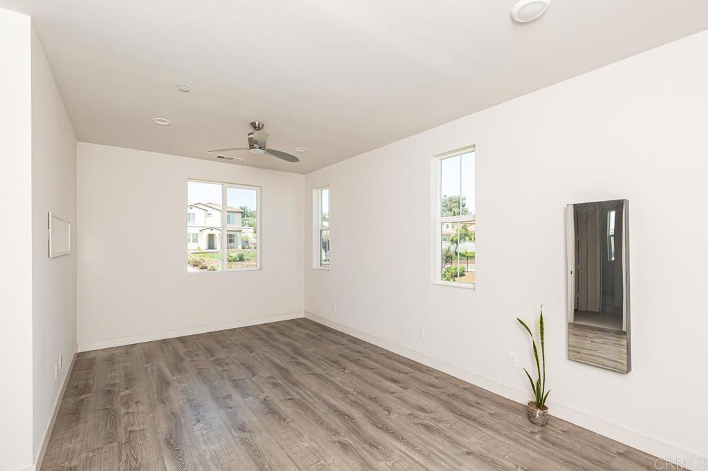 1281 Palomar Circle Escondido, CA 92027 - Photo 22 of 31 an empty room with windows and closet