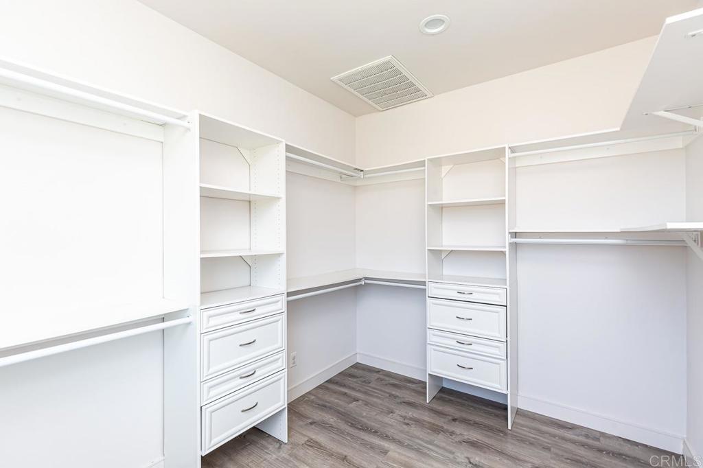 1281 Palomar Circle Escondido, CA 92027 - Photo 24 of 31 a view of walk in closet with empty racks